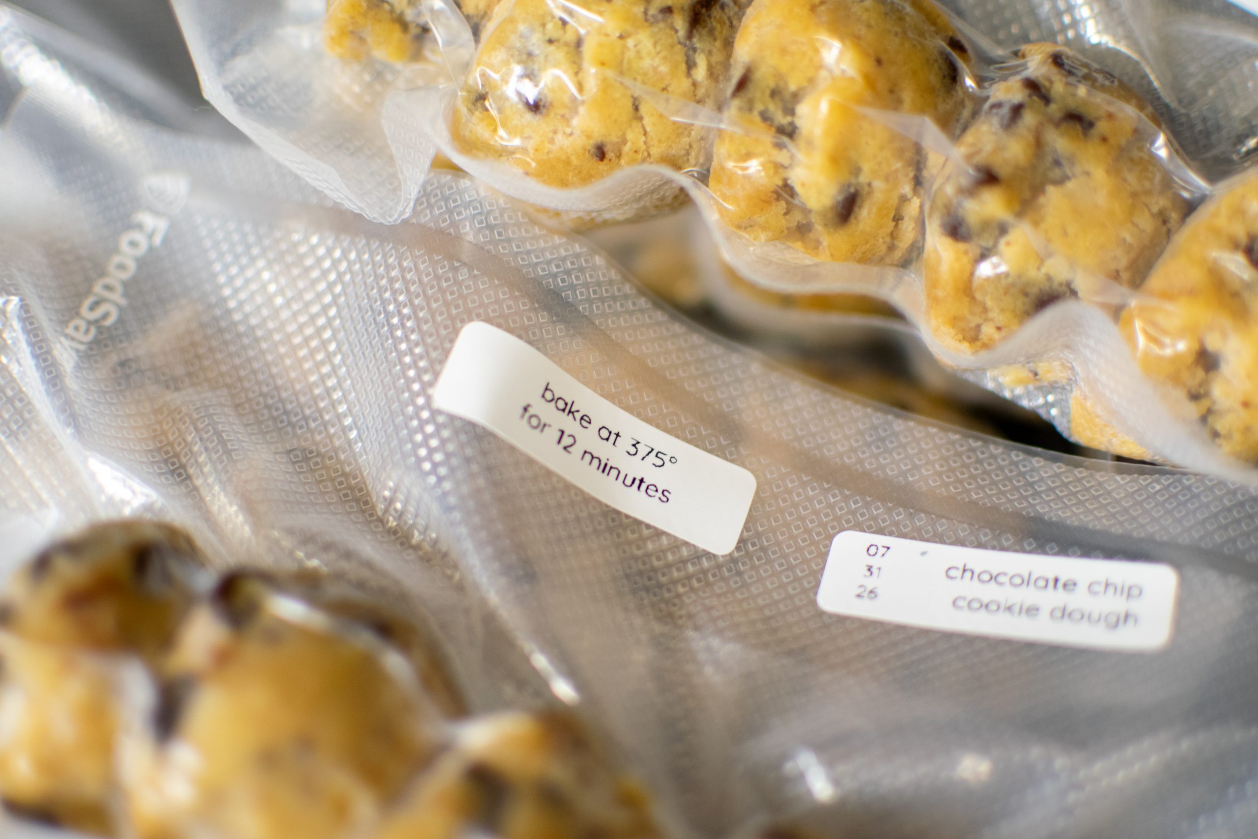 labeled vacuum-sealed bags of frozen chocolate chip cookie dough