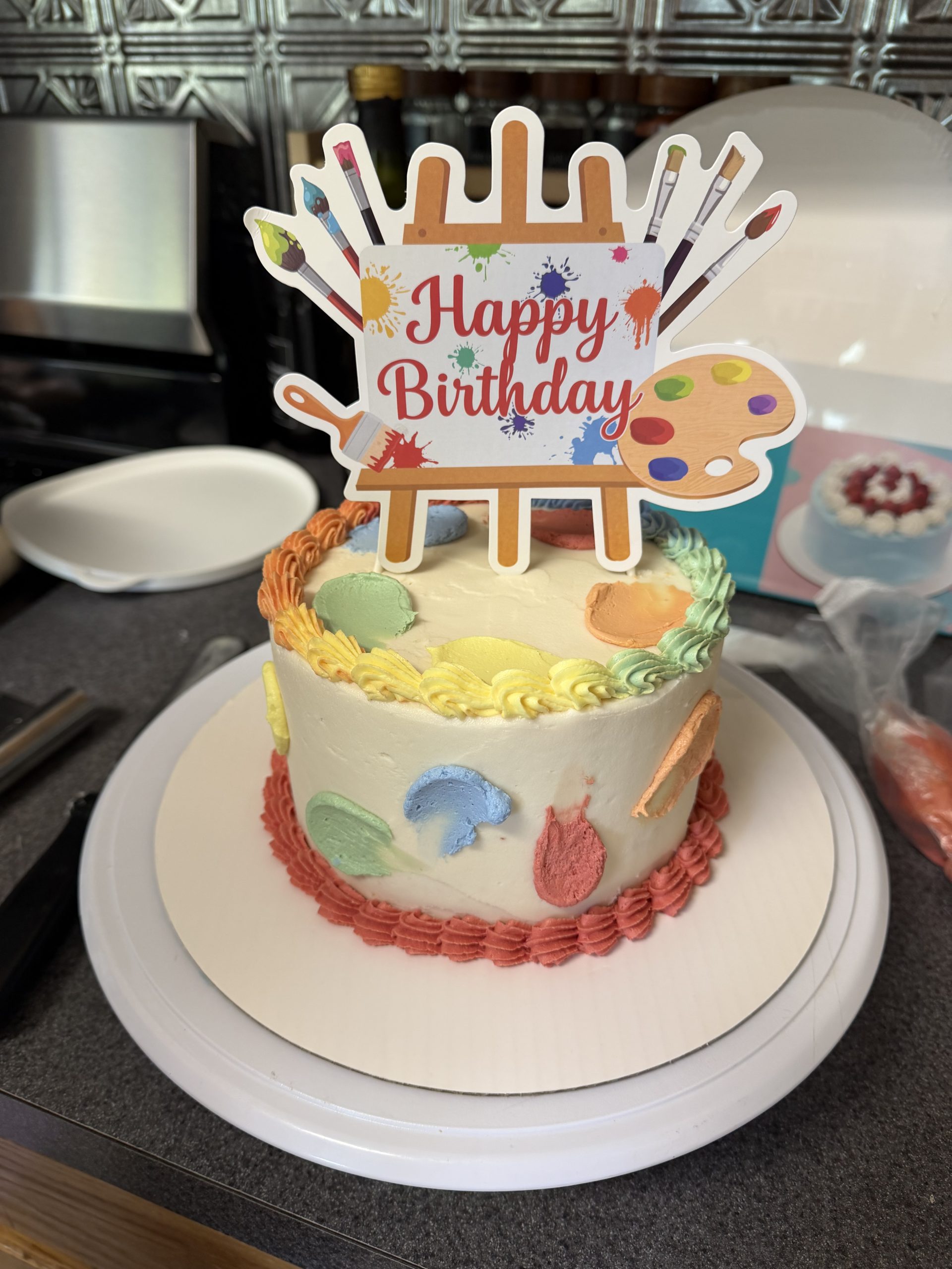 Six-inch art-themed birthday cake for the adults
