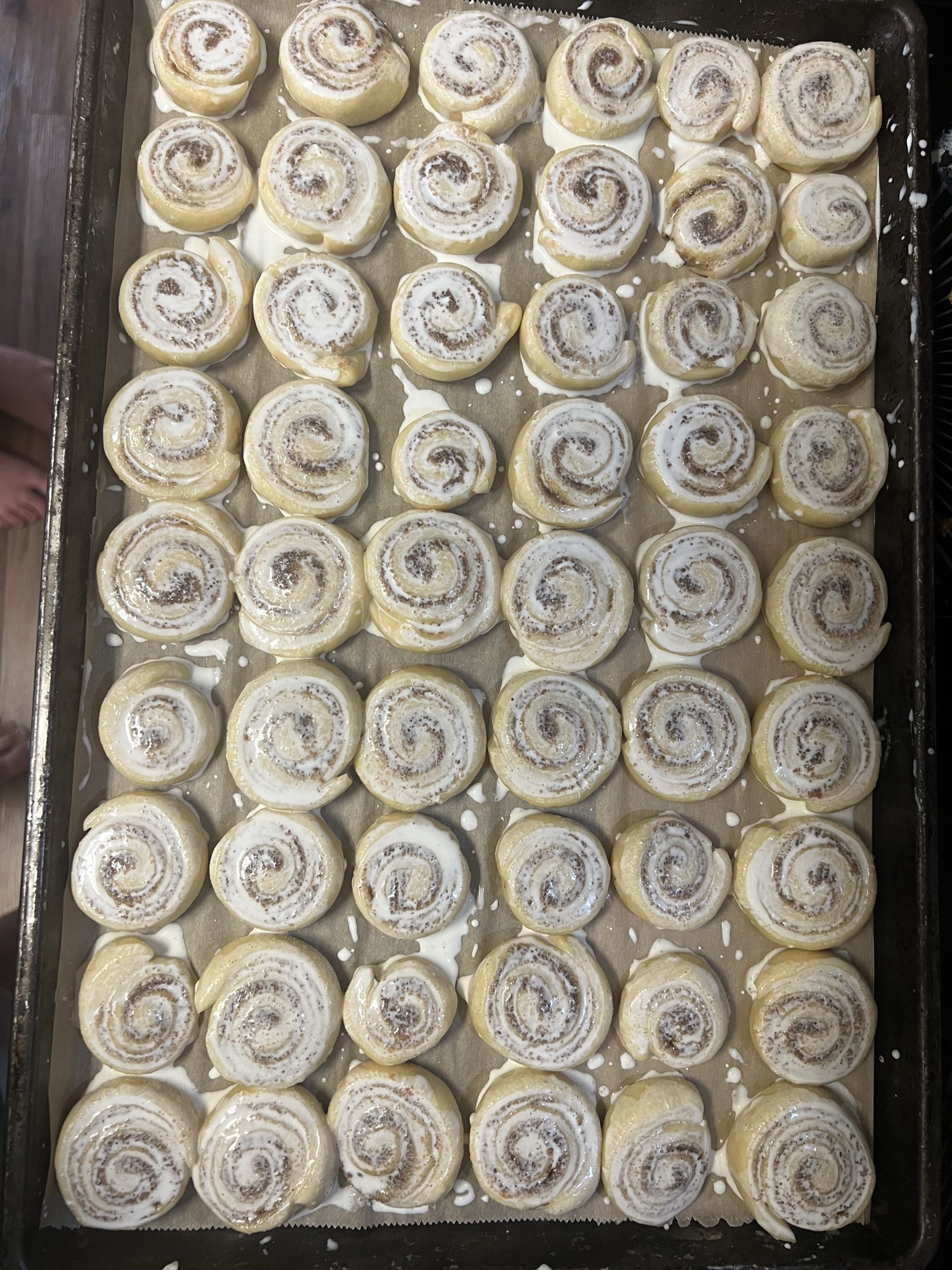 Silver-dollar mini cinnamon rolls brushed with heavy cream before baking